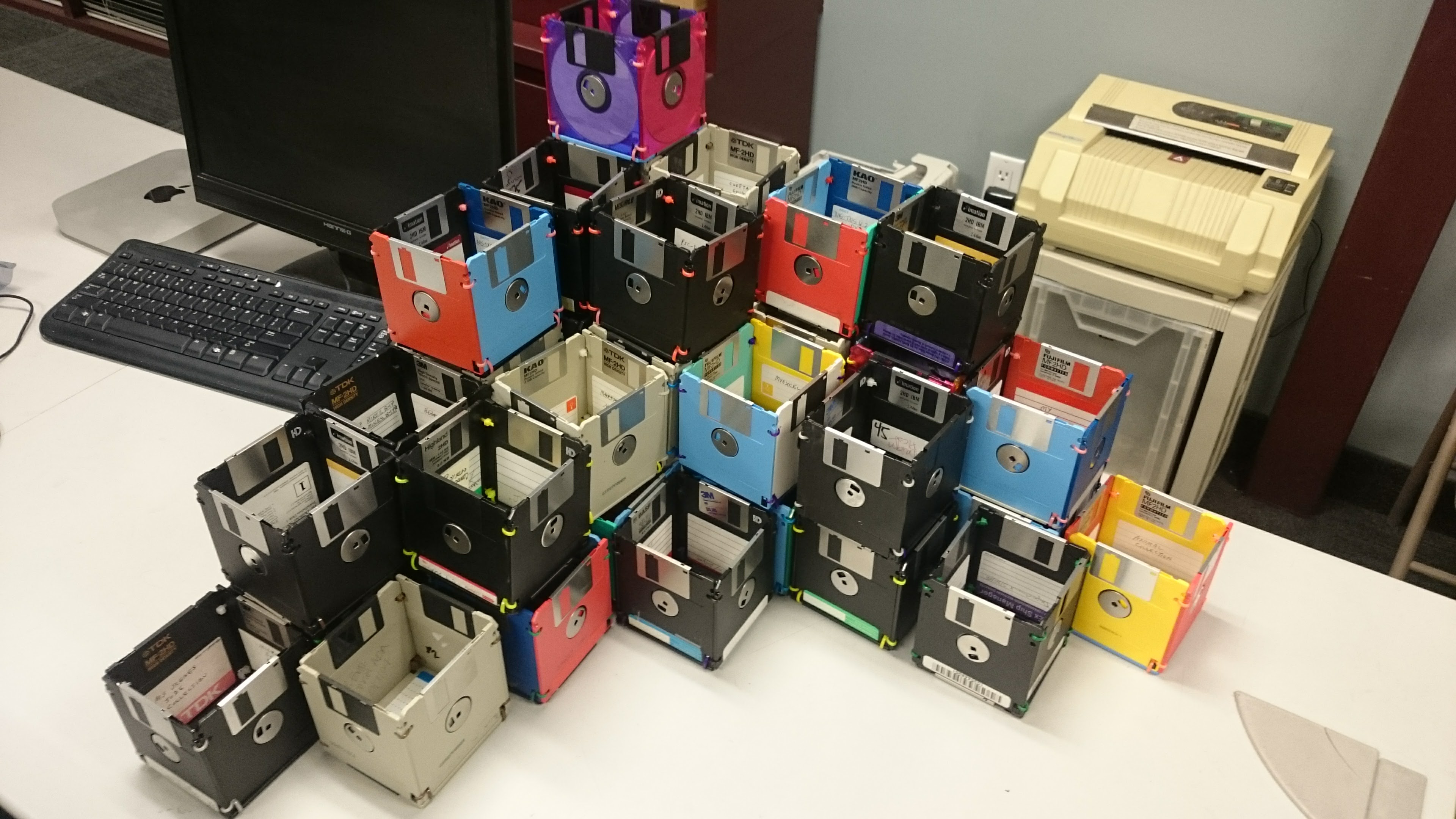 A tower of colorful floppy disks